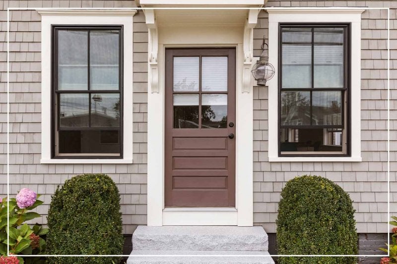 chocolate brown color front door (Photo by dpproductions/iStock/Getty Images Plus via Getty Images)