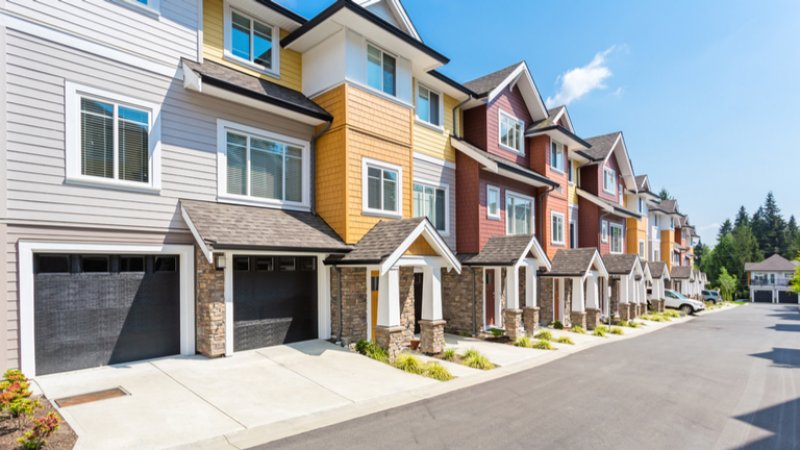 Row of colorful townhomes Row of colorful townhomes (Photo by rawmn/Shutterstock)