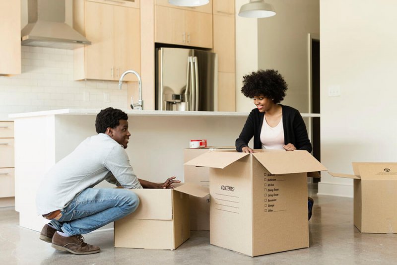 Couple packing moving boxes Couple packing moving boxes (Photo by Roberto Westbrook via Getty Images)