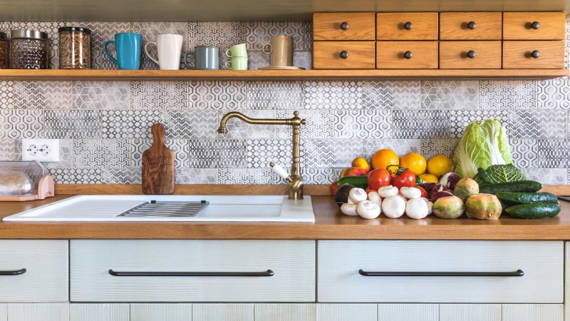 Detail of a rustic kitchen with vegetables on the countertop (Photo by borcee/E+ via Getty Images)
