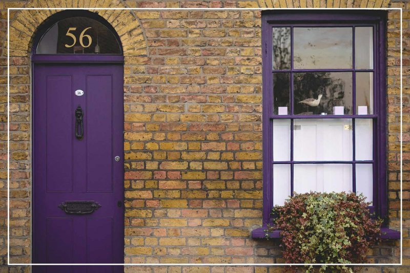 eggplant color front door (Photo by Paolo Paradiso/Shutterstock.com)