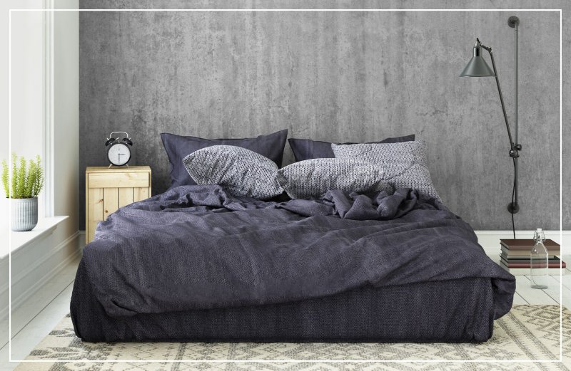 faux concrete wall in bedroom (Photo by ExperienceInteriors / E+ via Getty Images)