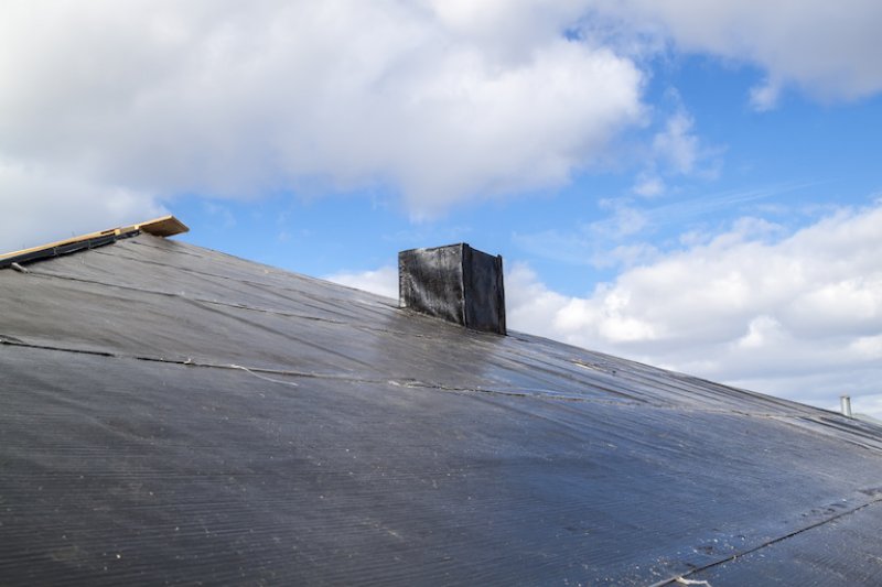 closeup view of flat black roofing (Photo by © sommersby - stock.adobe.com)