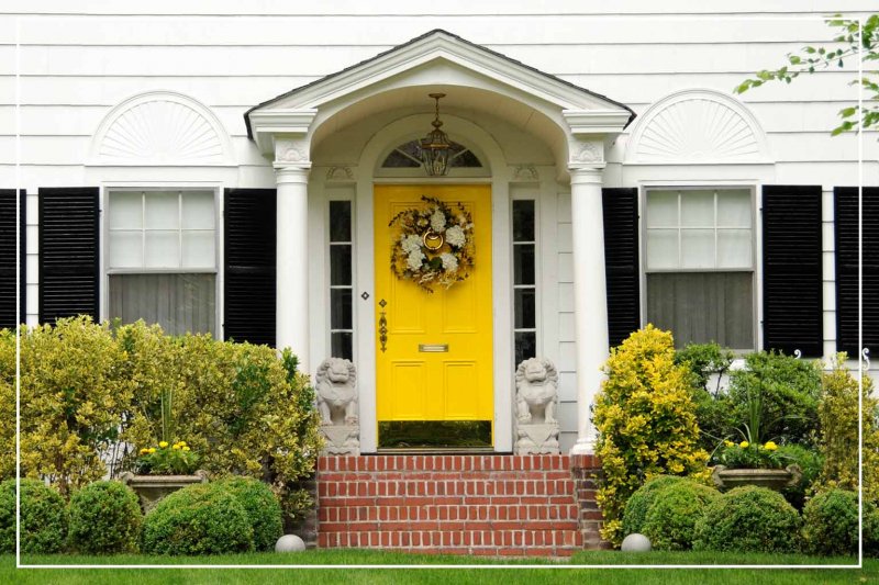 golden yellow front door (Photo by SondraP/iStock/Getty Images Plus via Getty Images)