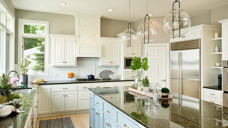 High contrast black, light blue and white kitchen (Photo by YinYang / E+ via Getty Images)