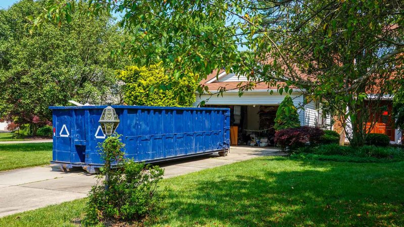 Dumpster in front of house (Photo by ALAN - stock.adobe.com)