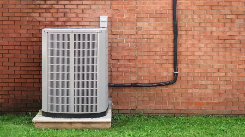 A HVAC system in a yard (Photo by Thelma Lanteigne / EyeEm/EyeEm via GettyImages)