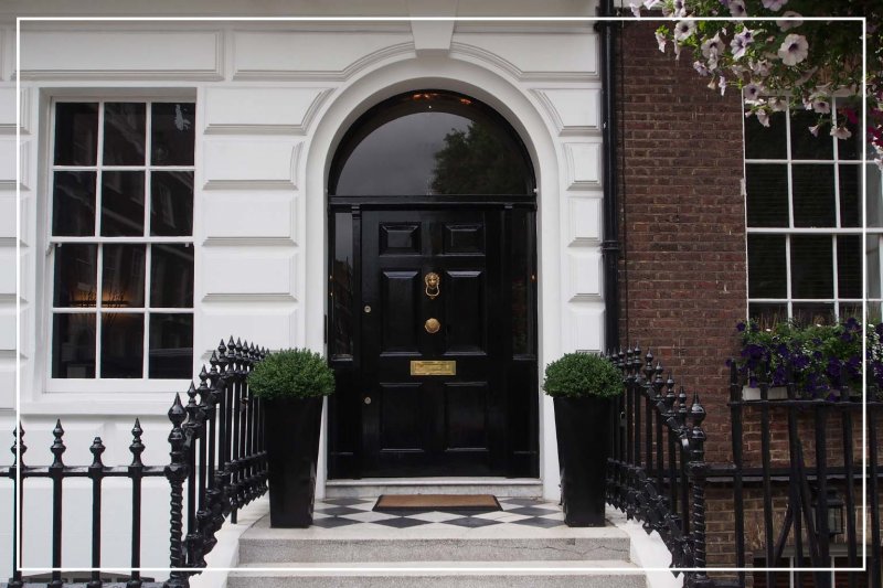 jet black color front door (Photo by peterspiro/iStock/Getty Images Plus via Getty Images)