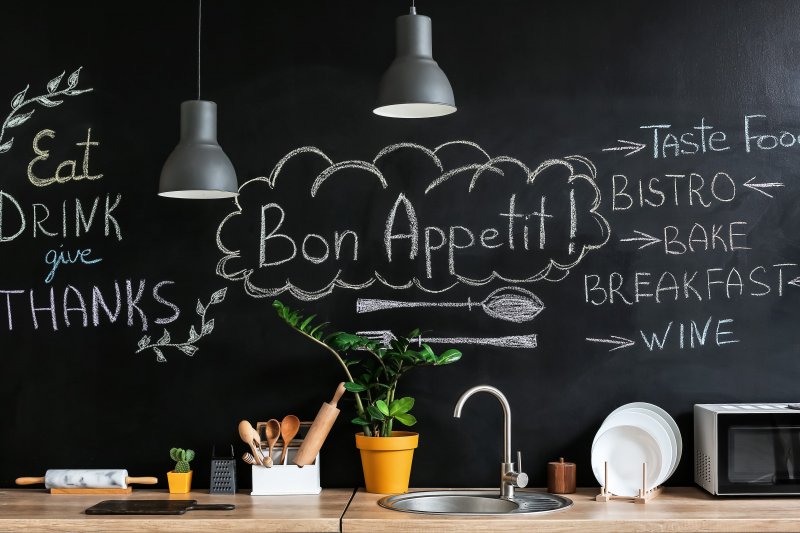 Chalkboard accent wall in kitchen (Photo by Pixel-Shot - stock.adobe.com)