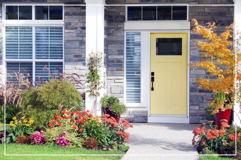 lemon yellow front door (Photo by Hannamariah/Shutterstock.com)