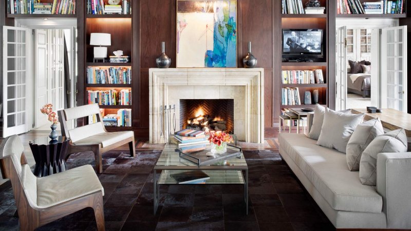 A living room with lots of books and a fireplace (Photo by Michael Robinson/Corbis Documentary via Getty Images)