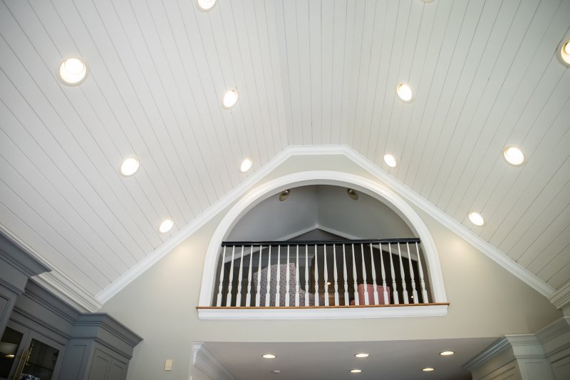 Shiplap cathedral ceiling with can lights and upper loft (Photo by Ursula Page - stock.adobe.com)