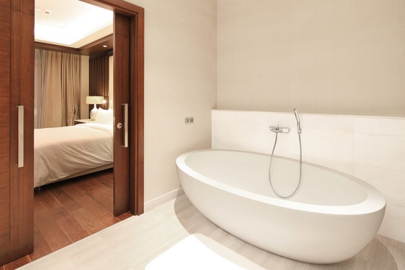 Luxury bathroom with sliding pocket doors (Photo by Anton_Sokolov/iStock/Getty Images Plus via Getty Images)