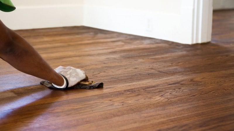 A man refinished a hardwood floor (Photo by digitalskillet1 - stock.adobe.com)