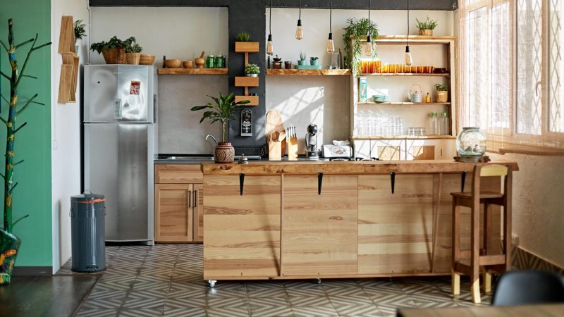 A modern rustic kitchen with wooden cabinets (Photo by xavierarnau/E+ via Getty Images)