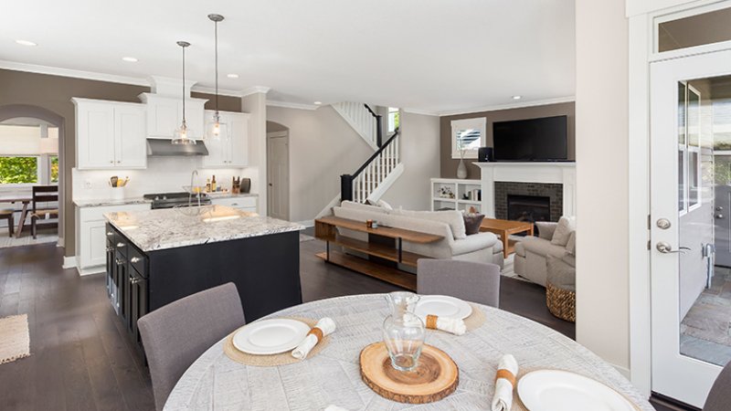 Open concept living room, kitchen and dining room (Photo by hikesterson / iStock / Getty Images Plus via Getty Images)