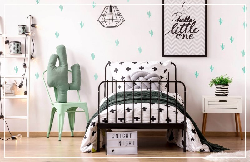 cacti-themed pattern wallpaper in bedroom (Photo by Photographee.eu/Shutterstock.com)