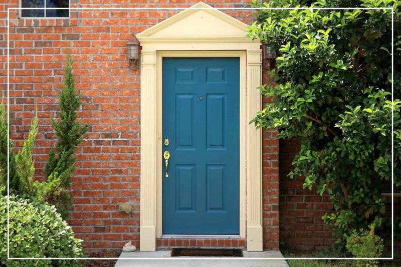 peacock blue-painted front door (Photo by imagedepotpro/iStock/Getty Images Plus via Getty Images)