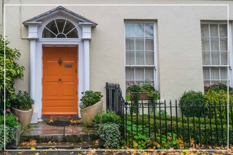 pumpkin orange front door (Photo by vicentegarridoj/Shutterstock.com)