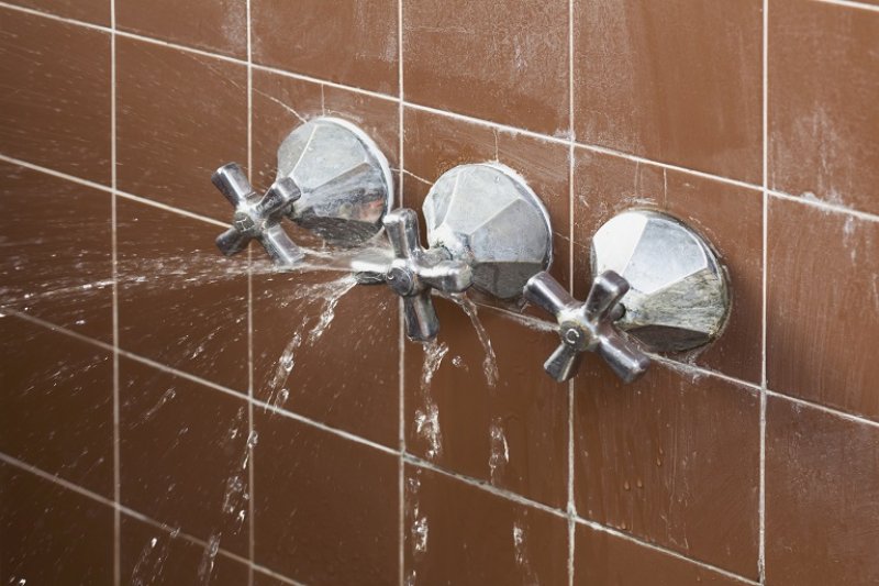 Shower faucet leaking (Photo by Patrick Strattner via Getty Images)