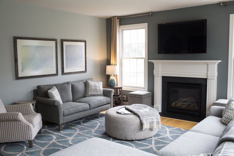 Small living room with blue accent wall (Photo by Cavan Images /Cavan via Getty Images)