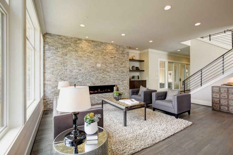 Stone accent wall in living room (Photo by Iriana Shiyan - stock.adobe.com)