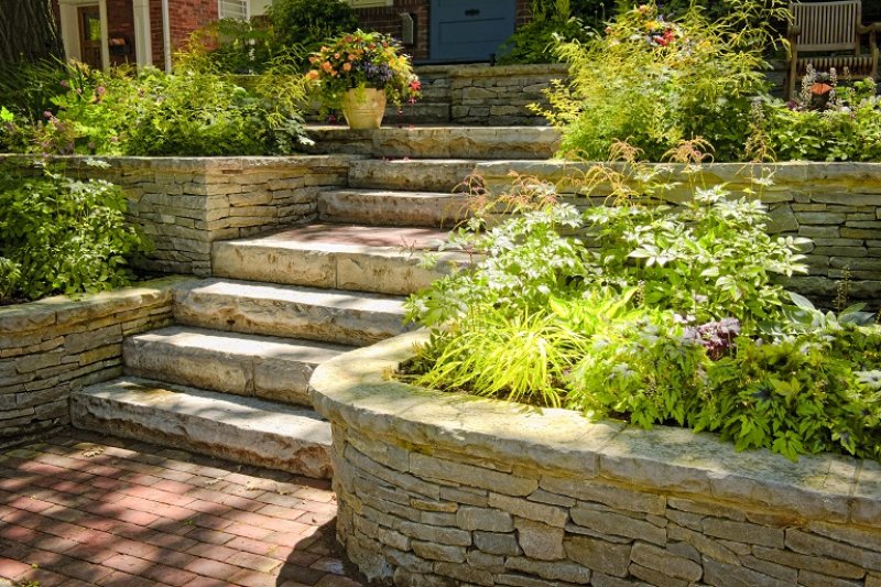 Natural stone steps with planters (Photo by © Elenathewise - stock.adobe.com)