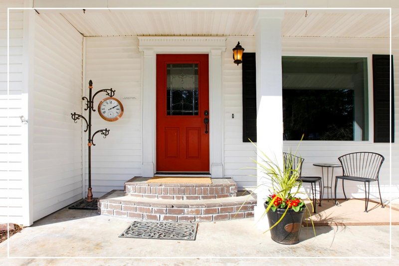 strong red color front door (Photo by irina88w/iStock/Getty Images Plus via Getty Images)