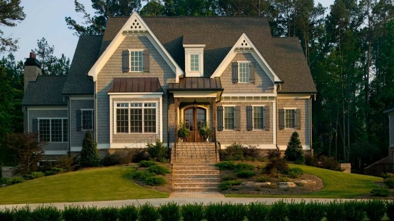 A suburban house with landscaped lawn (Photo by Phillip Spears/DigitalVision - stock.adobe.com)