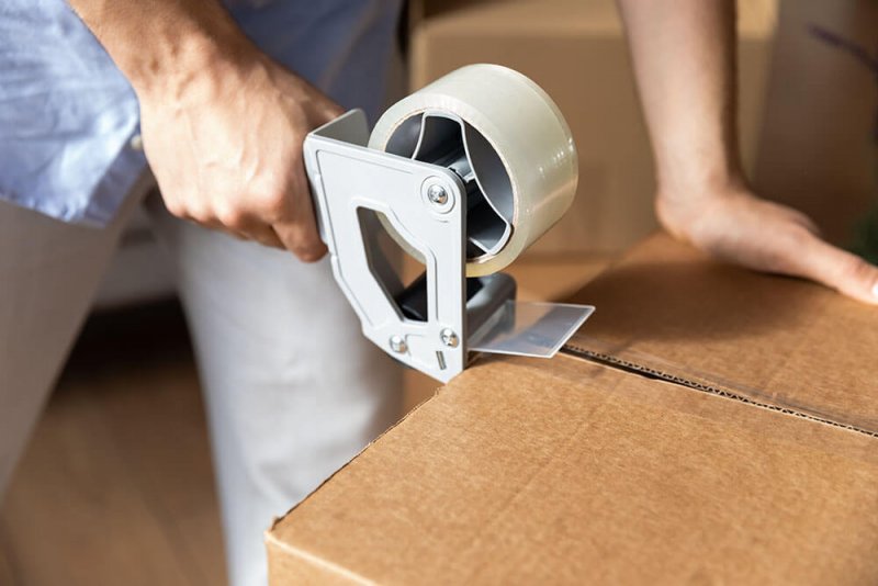 Hand taping box Hand taping box (Photo by fizkes/iStock/Getty Images Plus via Getty Images)