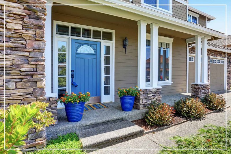 tropical blue-painted front door (Photo by irina88w/iStock/Getty Images Plus via Getty Images)