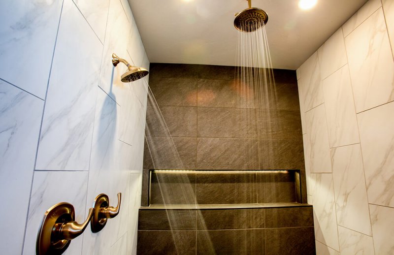 Luxury walk-in shower with multiple shower heads Luxury walk-in shower with multiple shower heads (Photo by grandriver/iStock/Getty Images Plus via Getty Images)