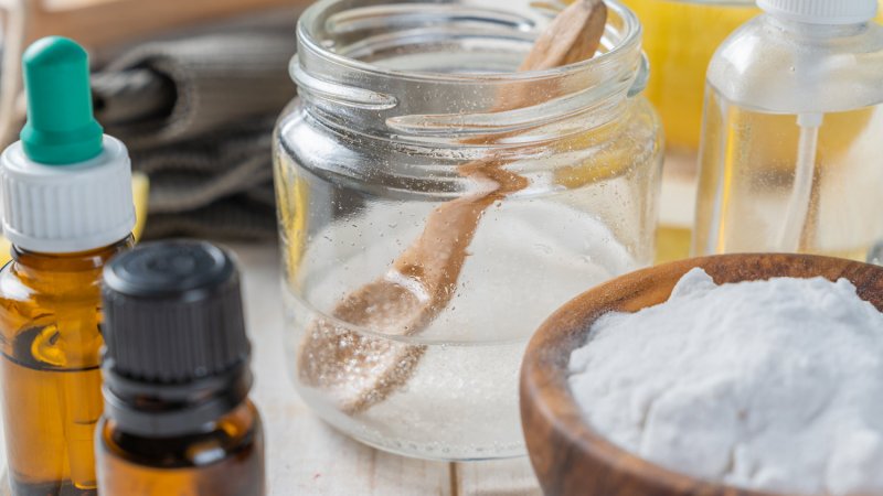 A jar with white vinegar and other eco cleaning ingredients (Photo by a_namenko/iStock / Getty Images Plus via Getty Images)