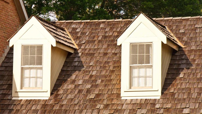 Two dormers on wood shaker roof (Photo by dbvirago - stock.adobe.com)