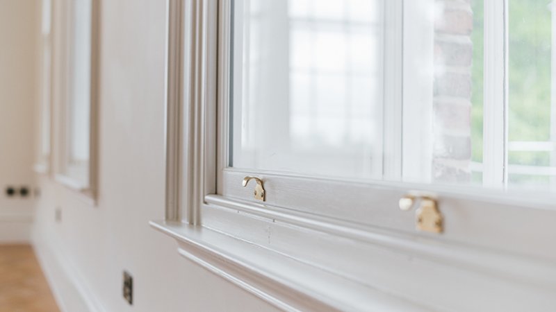 Closeup of wood windows (Photo by By Wirestock - stock.adobe.com)