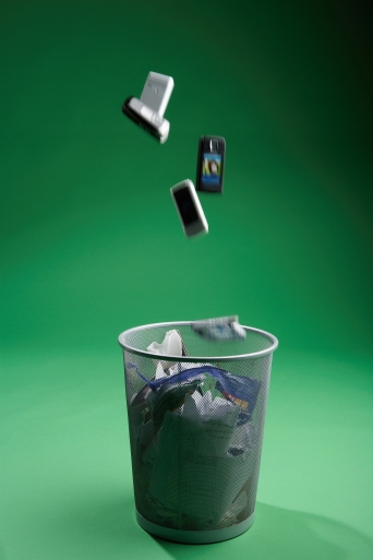 cell phones being thrown in the garbage
