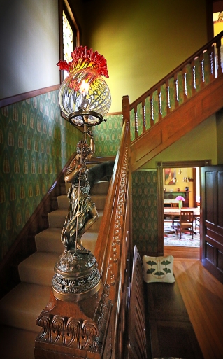 a statute and banister inside an Old Northside home in Indianapolis