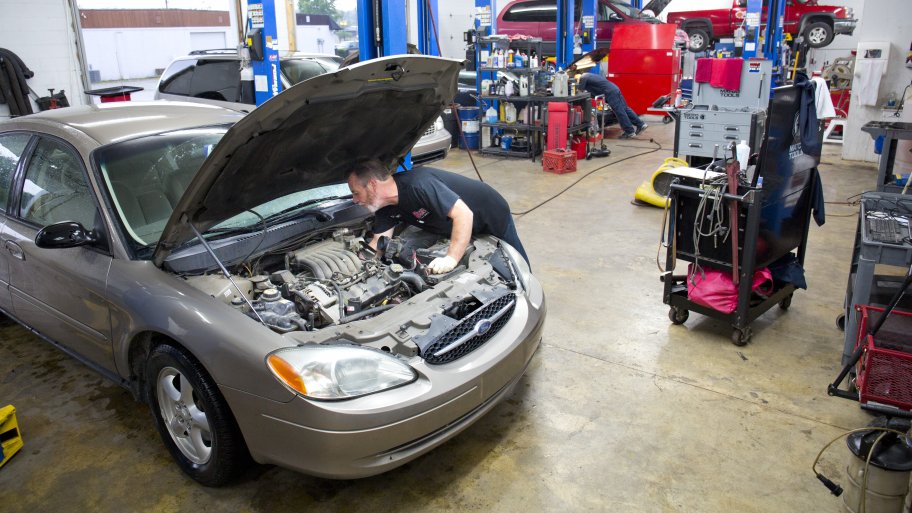 mechanic working on a car