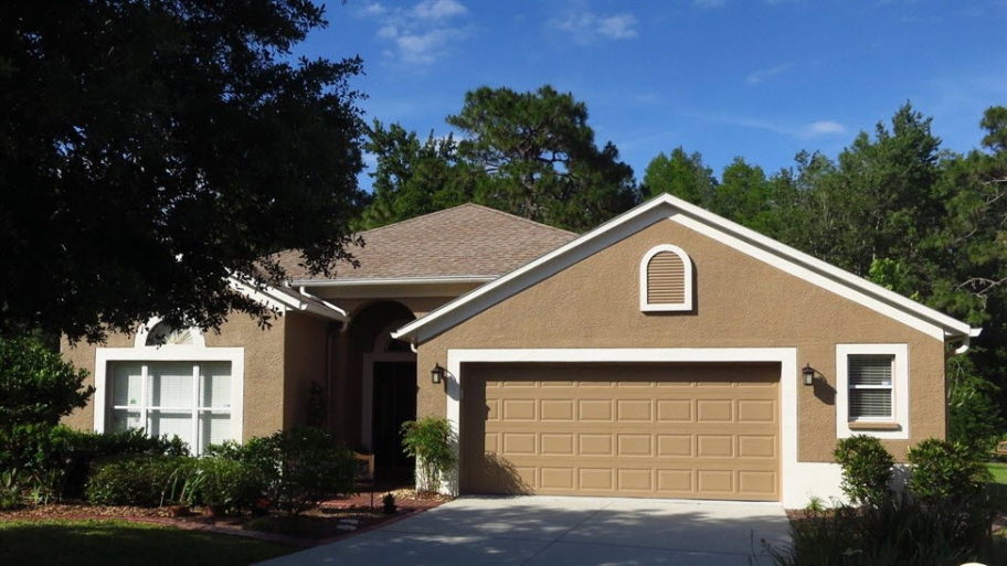a brown house with white trim