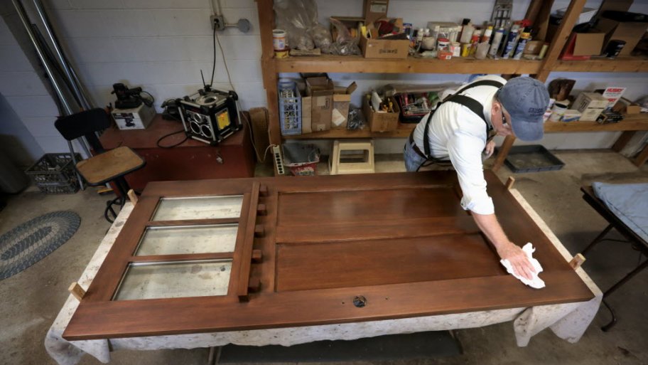 Finishing an old door at The Front Gate in Indianapolis