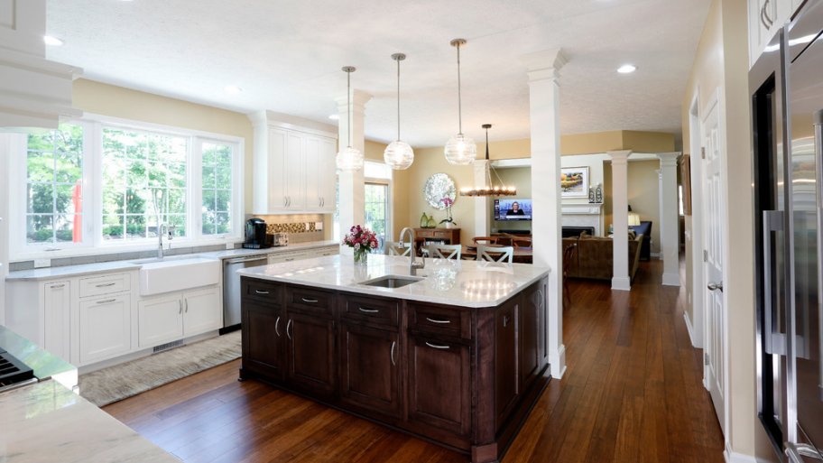 A white kitchen with wood floors