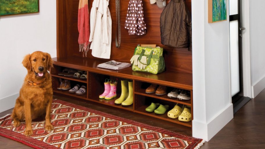 mudroom with rug and dog