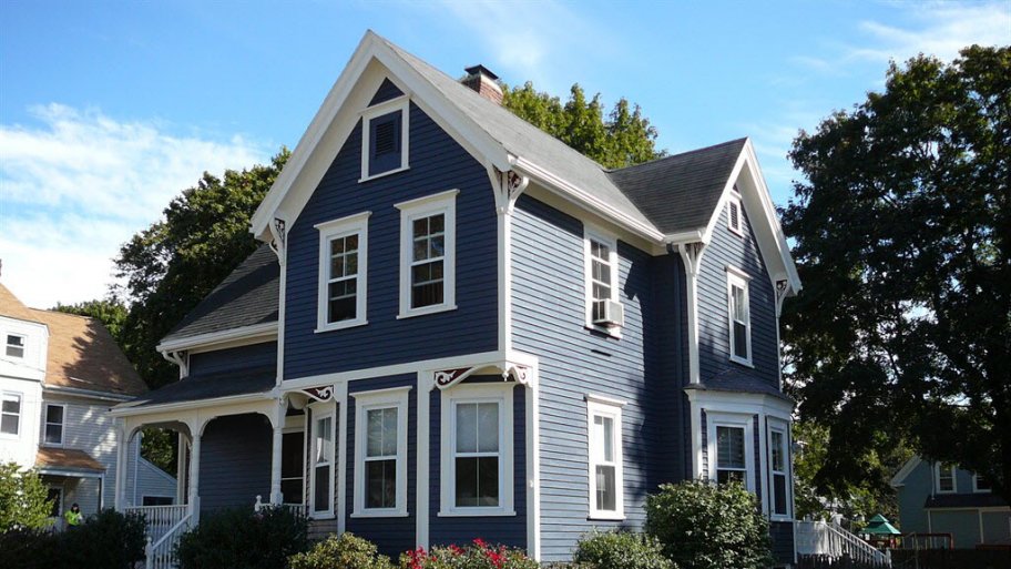 A blue house with white trim.