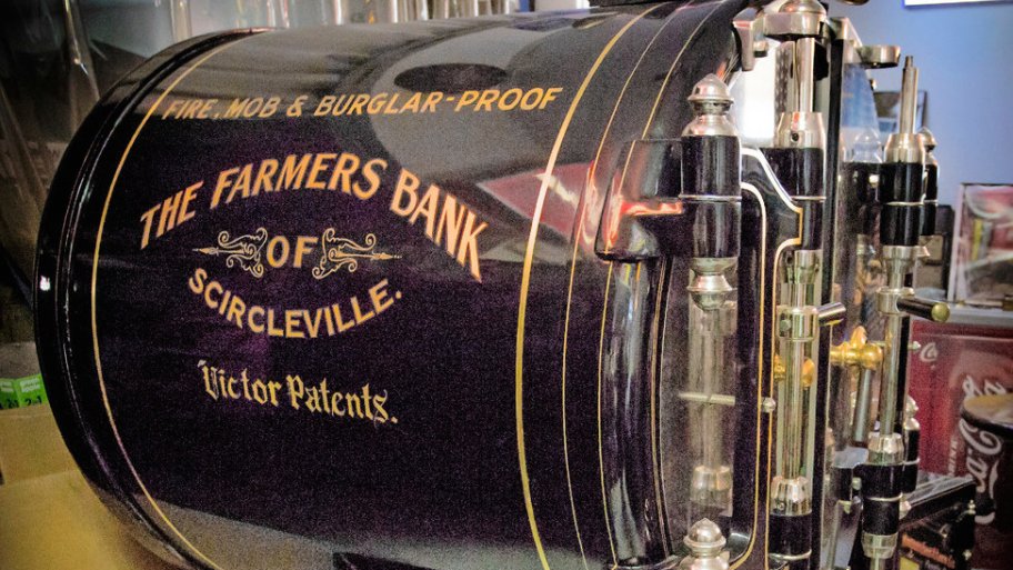 Black circular bank safe made in 1910 by Victor