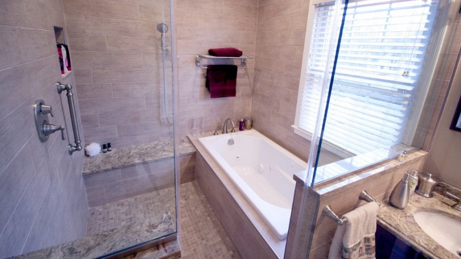 wet room bathroom with tub