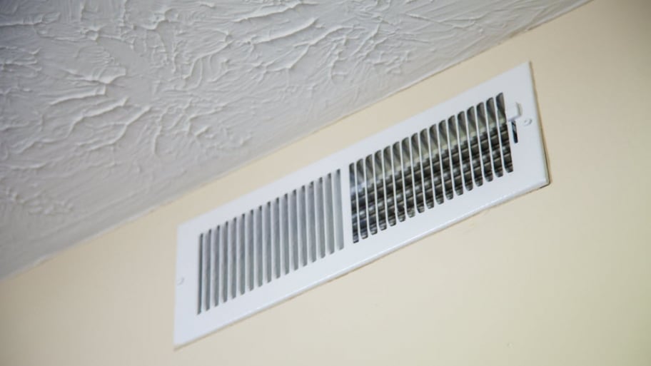 An HVAC vent on a wall