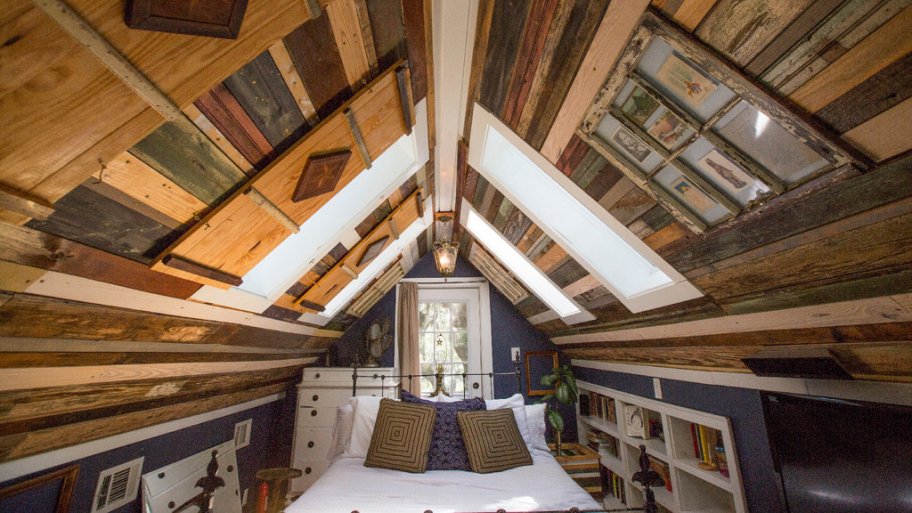 a bedroom with many panels of reclaimed wood in savannah georgia