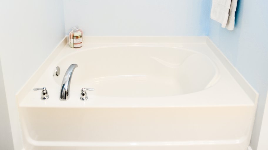 garden bathtub in bathroom with pale blue walls