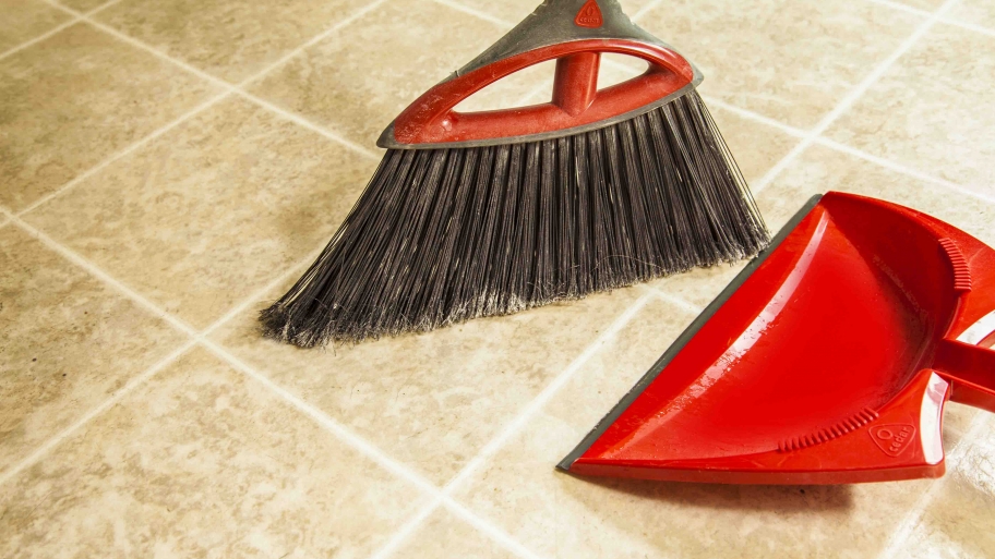 red broom and dust pan