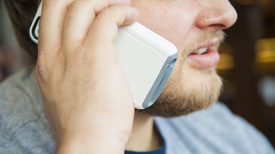 man on cell phone calling contractor references